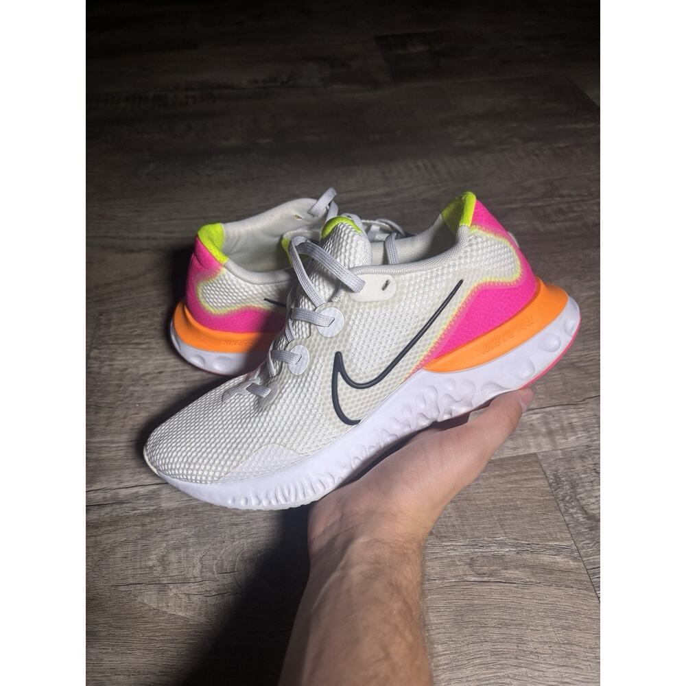 Nike Women's Renew Run running shoes in a white, pink, and orange Size 9